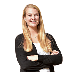 Headshot of Ali Rill, a white woman with blonde hair, smiling and crossing her arms